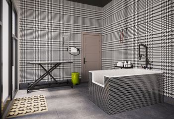 a bathroom with a white tub and a shower and a table